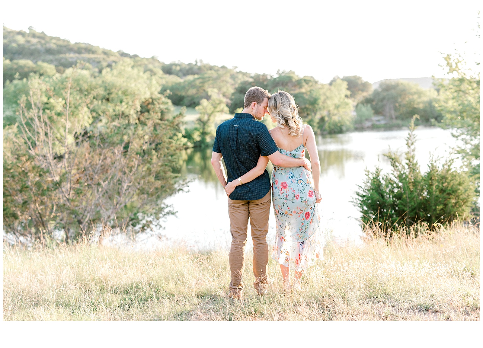 Couple Cuddling by the water for their downtown san antonio engagement session San Antonio Wedding Photographer