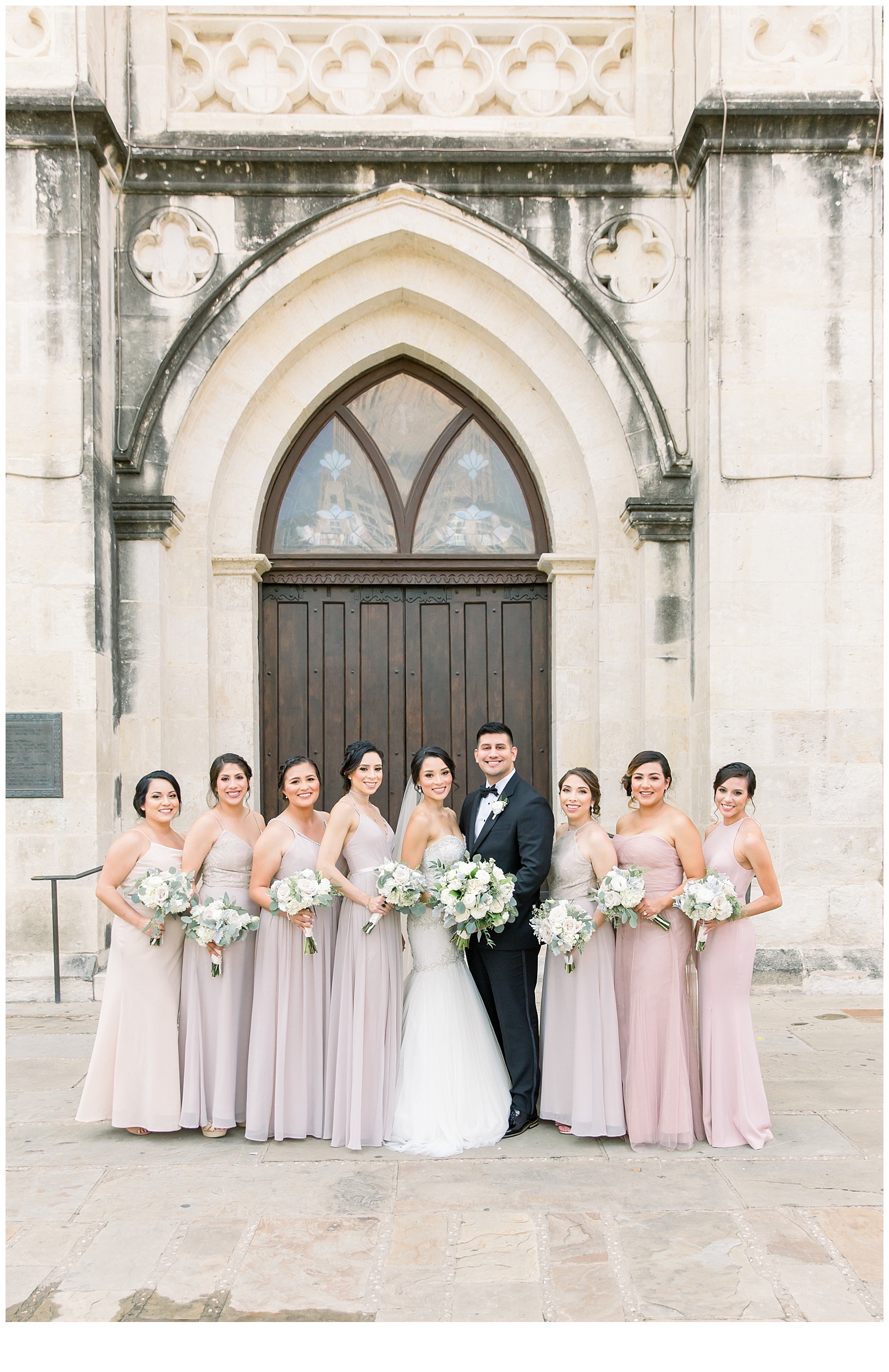 Bridesmaids take a photo with the couple for A San Fernando Cathedral Wedding in San Antonio, TX | Monica Roberts Photography | www.monicaroberts.com | San Antonio Wedding Photographer