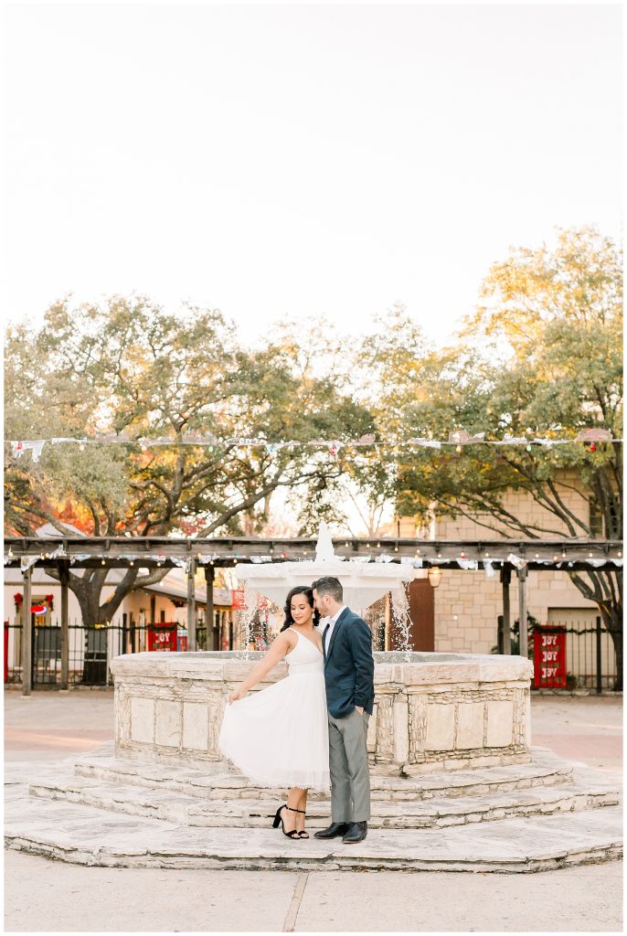 beautiful image of a couple by a fountain for a Gorgeous Downtown San Antonio Engagement Session with Monica Roberts Photography