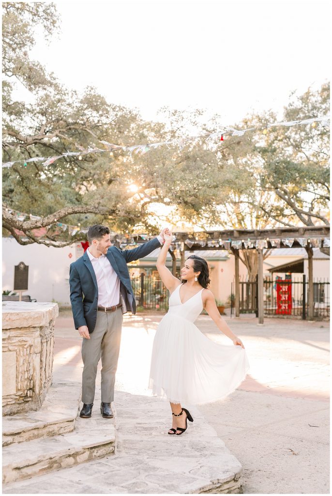 girl twirls with her Marilyn Monroe style dress for a Gorgeous Downtown San Antonio Engagement Session with Monica Roberts Photography