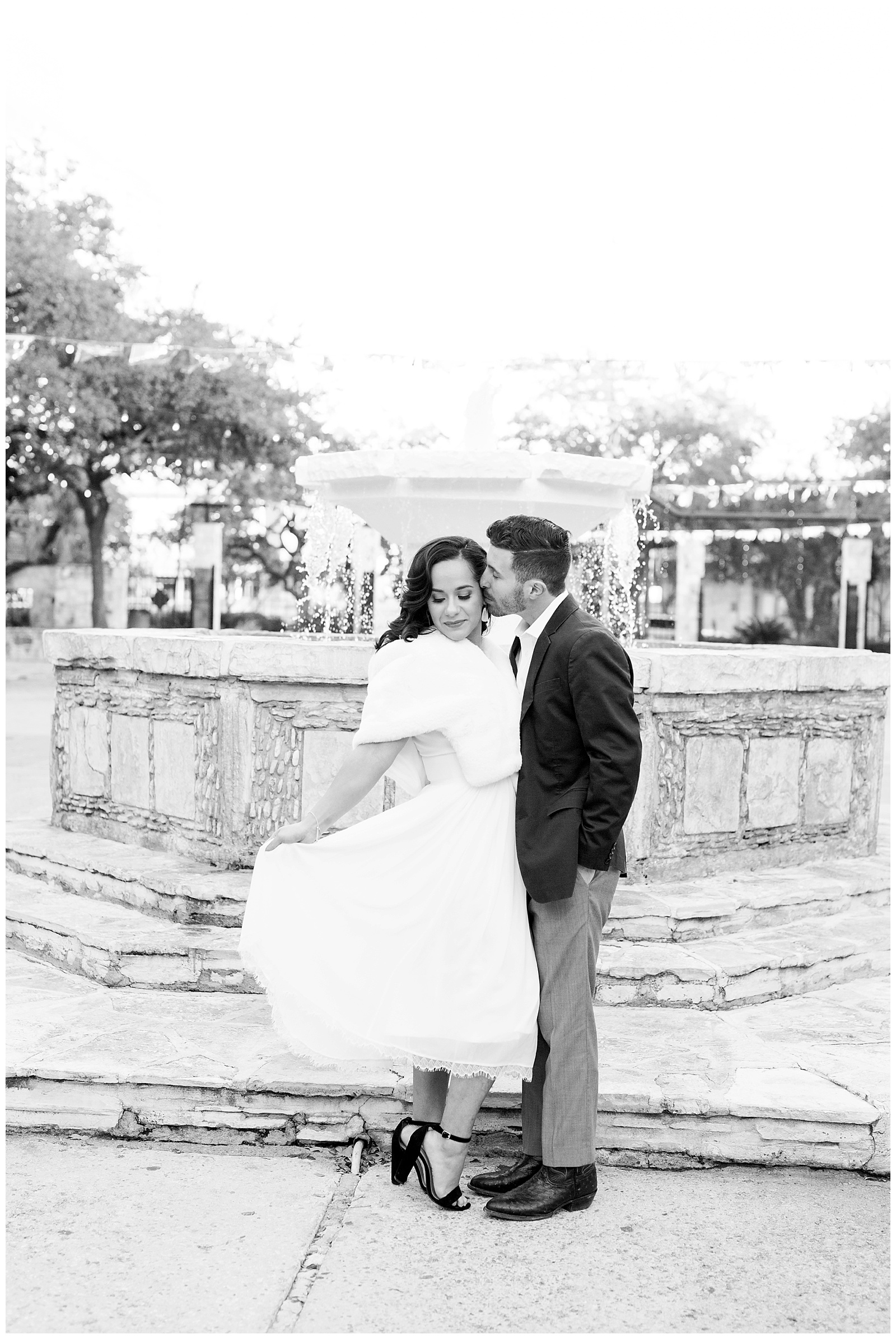 bride playing with her dress for a Gorgeous Downtown San Antonio Engagement Session with Monica Roberts Photography