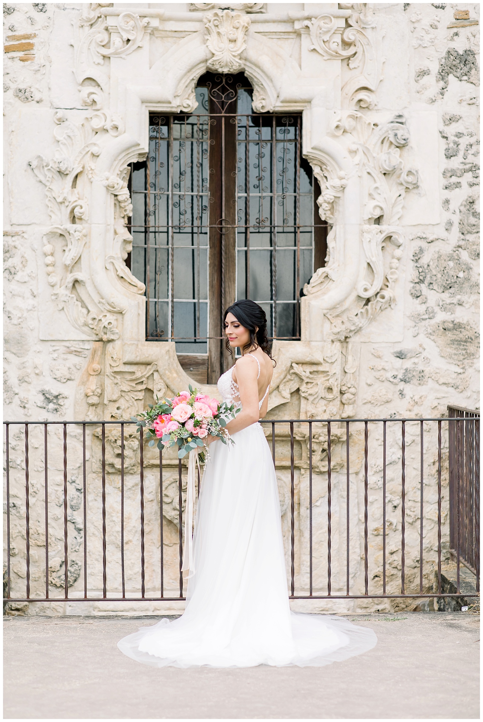 Bride showing off the back of her dress for her Spanish Missions Bridal Portraits in San Antonio, TX with Monica Roberts Photography | www.monicaroberts.com