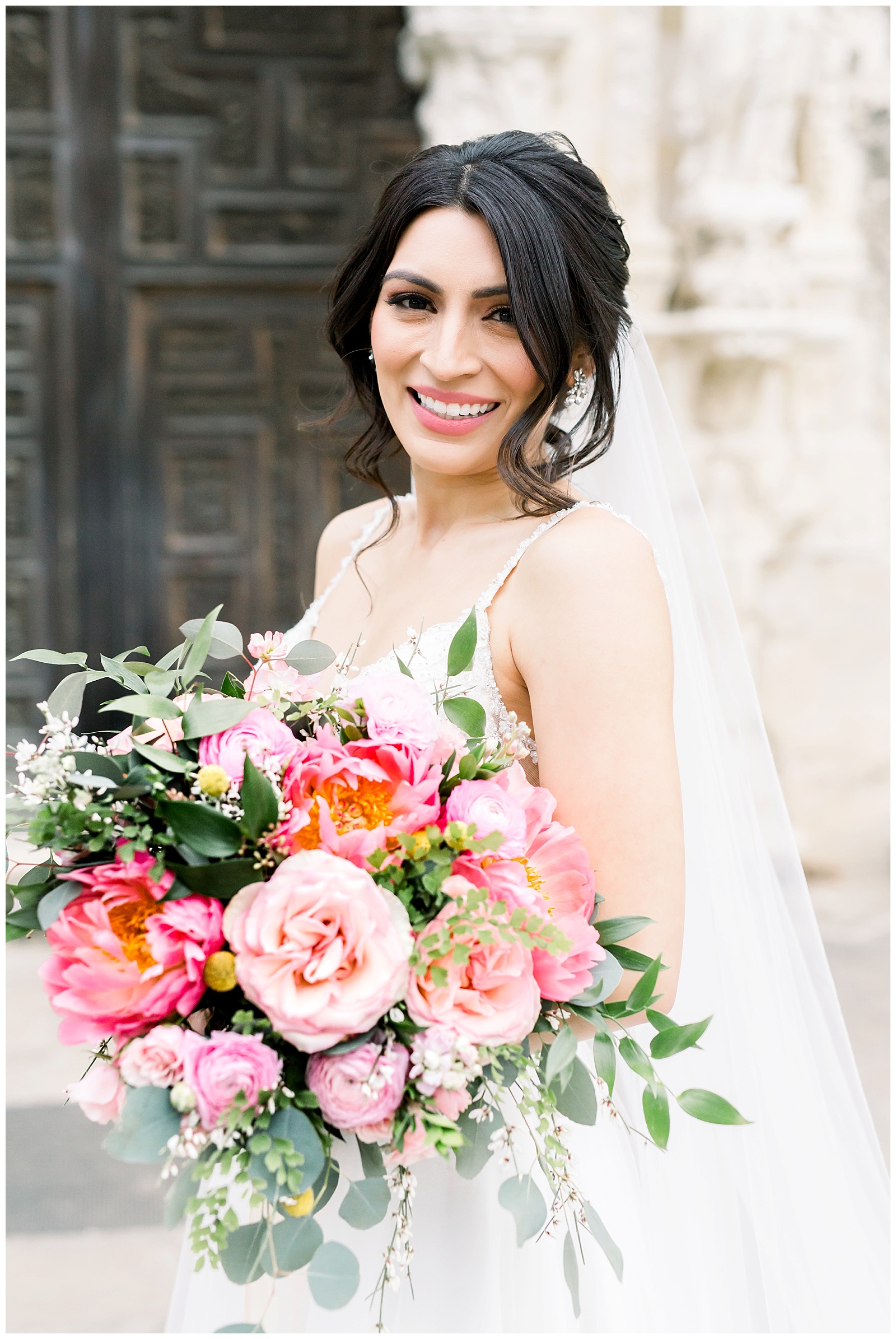 Bride smiling for her Spanish Missions Bridal Portraits in San Antonio, TX with Monica Roberts Photography | www.monicaroberts.com