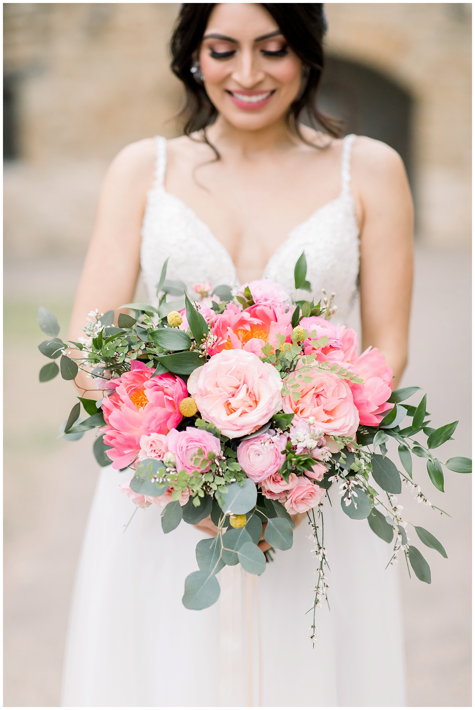 romantic bridal bouquet with pink and orange for her Spanish Missions Bridal Portraits in San Antonio, TX with Monica Roberts Photography | www.monicaroberts.com
