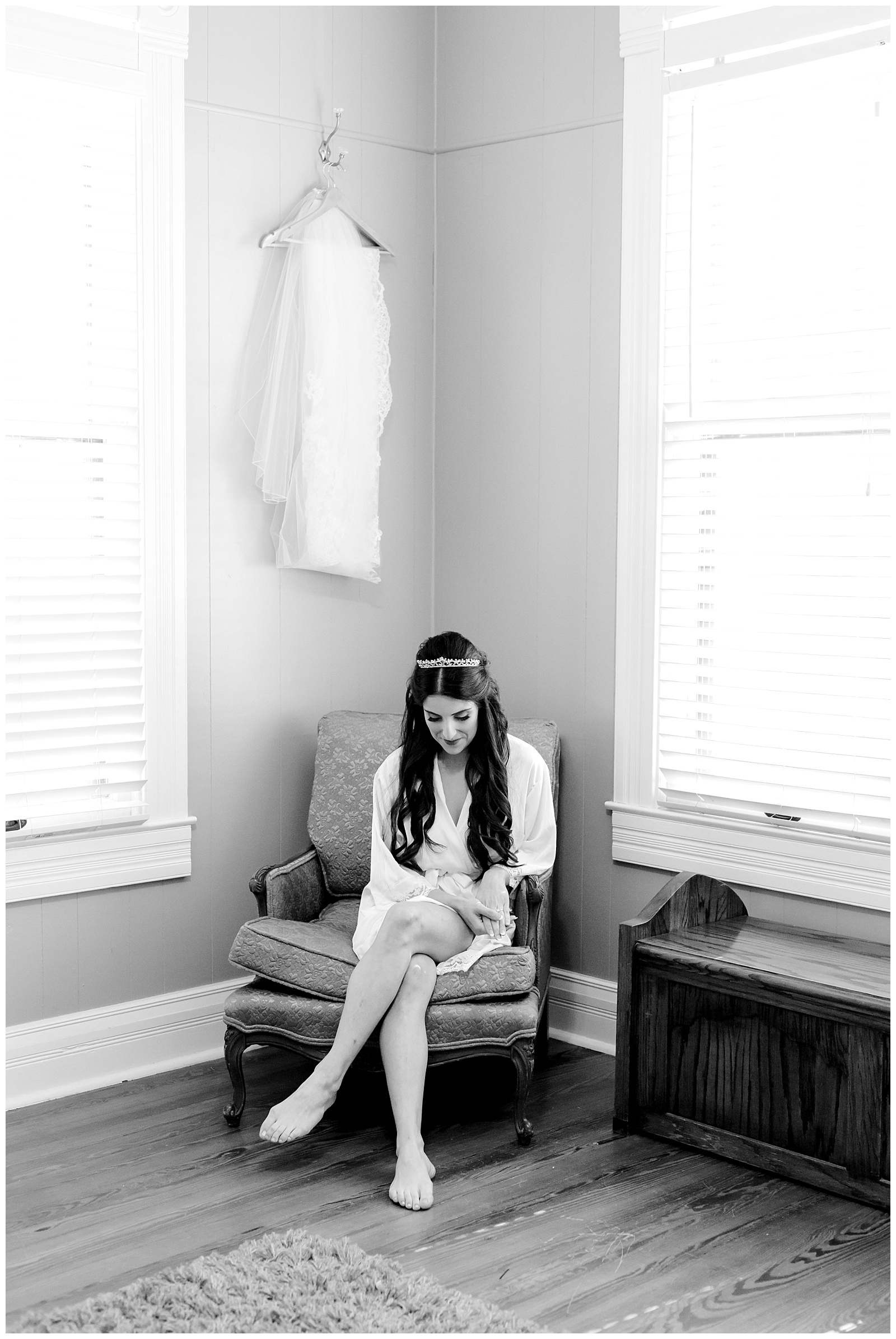 Black and white shot of bride sitting in chair while getting ready for a Romantic Wedding at The Allen Farmhaus in New Braunfels, TX | San Antonio-Maui-Destination Wedding Photographer | Monica Roberts Photography | www.monicaroberts.com
