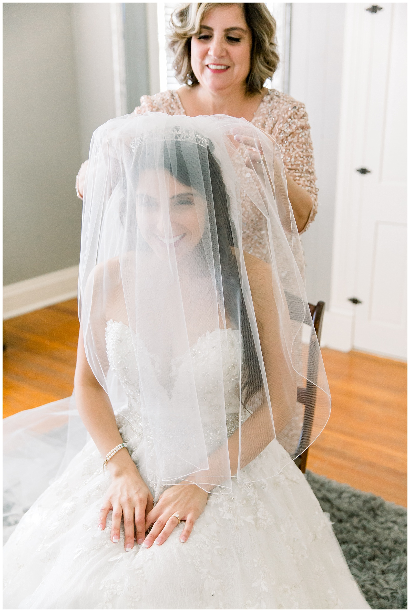 Special moment of bride's mother helping her put on her veil for a Romantic Wedding at The Allen Farmhaus in New Braunfels, TX | San Antonio-Maui-Destination Wedding Photographer | Monica Roberts Photography | www.monicaroberts.com