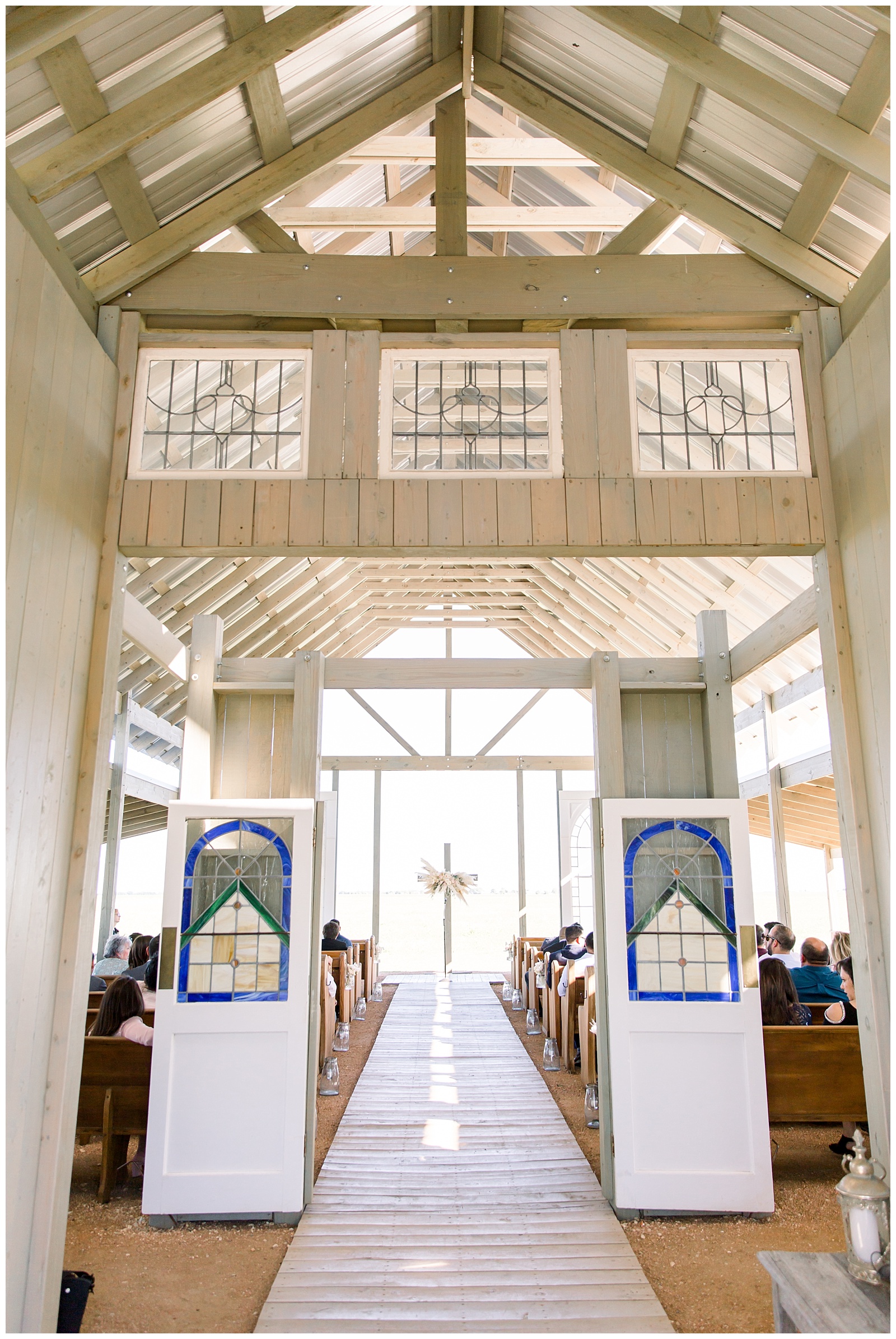 Beaming shot of sanctuary and cross alter -The Allen Farmhaus Wedding, TX by San Antonio-Maui-Destination Wedding Photographer | Monica Roberts Photography | www.monicaroberts.com