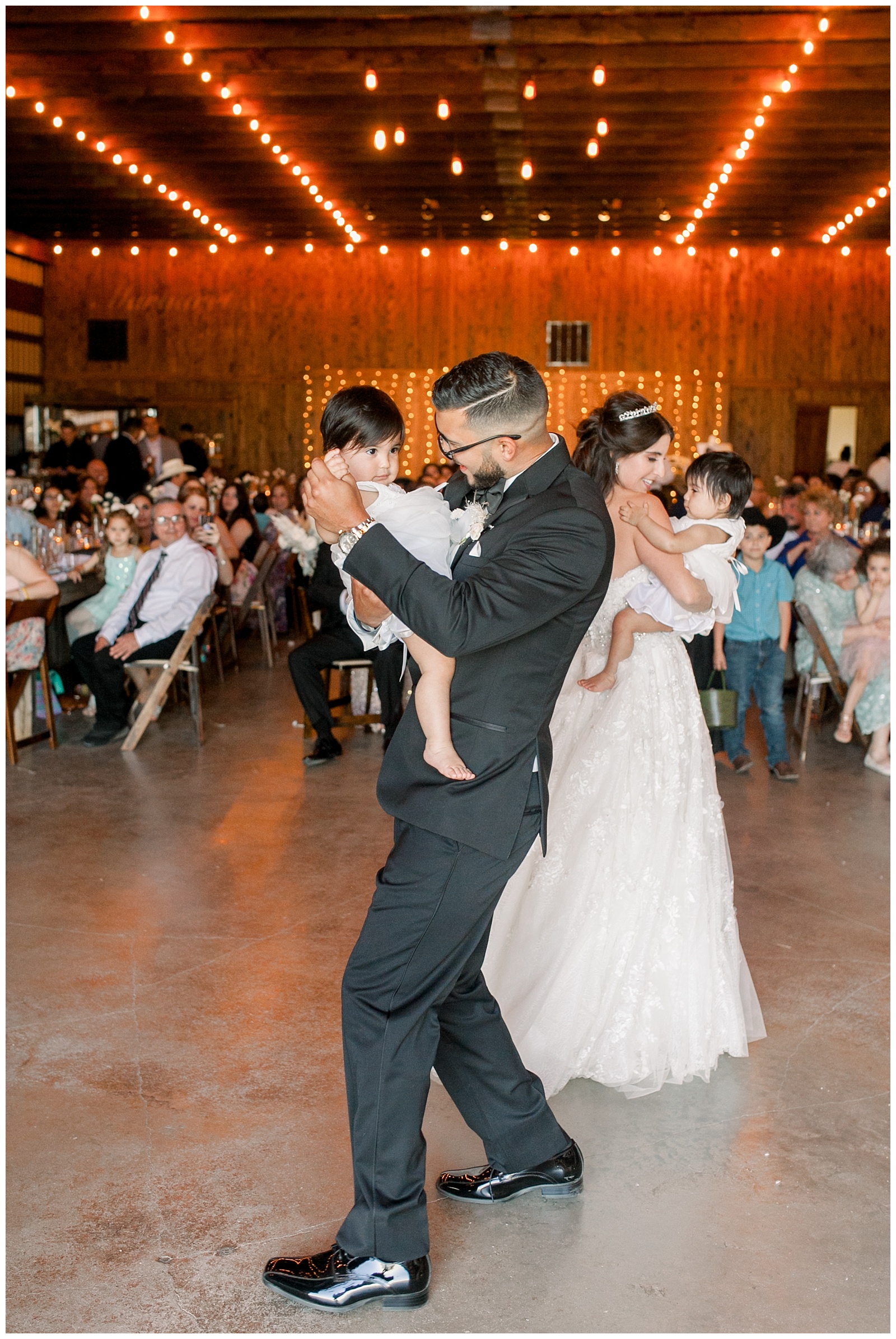 Bride and groom share their first dance with their two babies at The Allen Farmhaus Wedding, TX by San Antonio-Maui-Destination Wedding Photographer | Monica Roberts Photography | www.monicaroberts.com