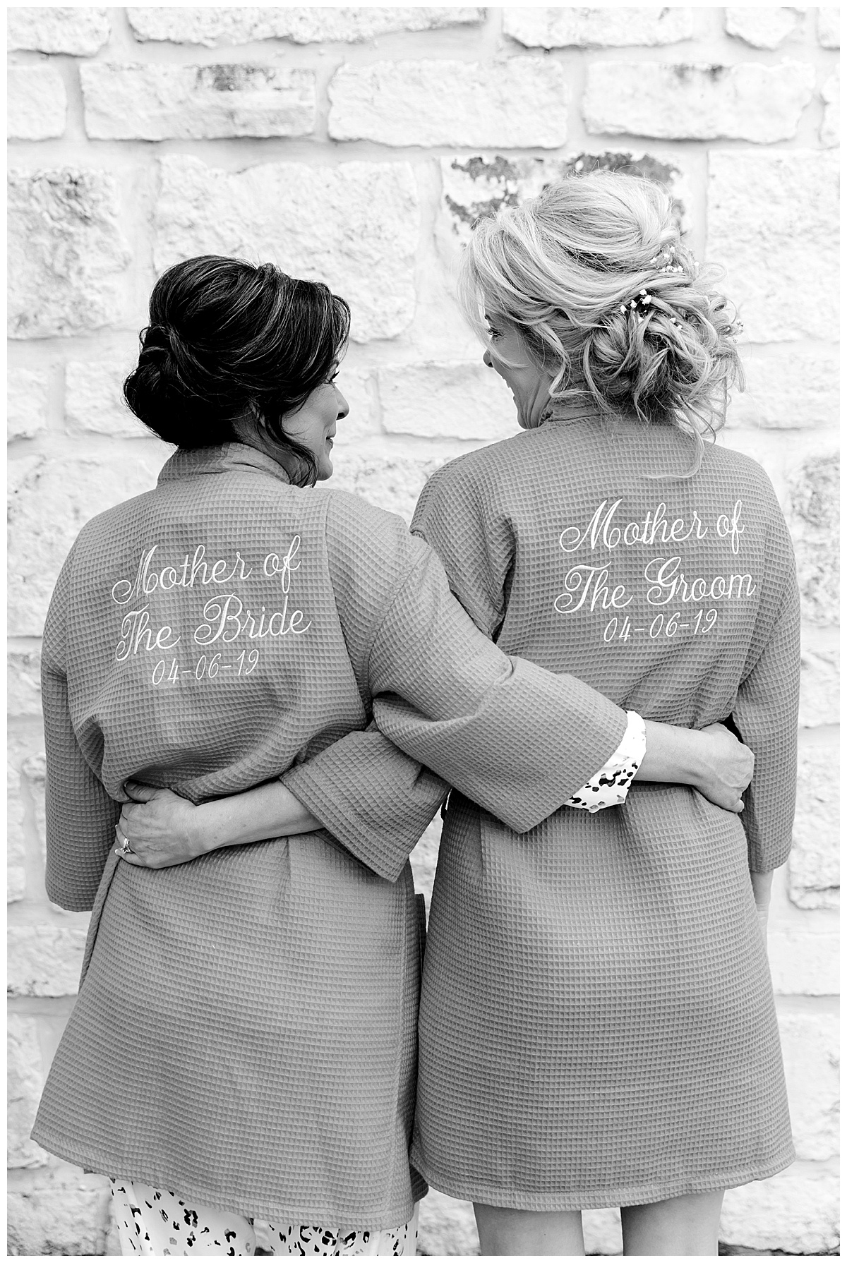 Mother of the bride and mother of the groom standing side by side in customized robes at Hyatt Regency Hill Country Resort Wedding in San Antonio, TX | San Antonio Wedding photographer| Destination Wedding Photographer| Monica Roberts Photography | monicaroberts.com