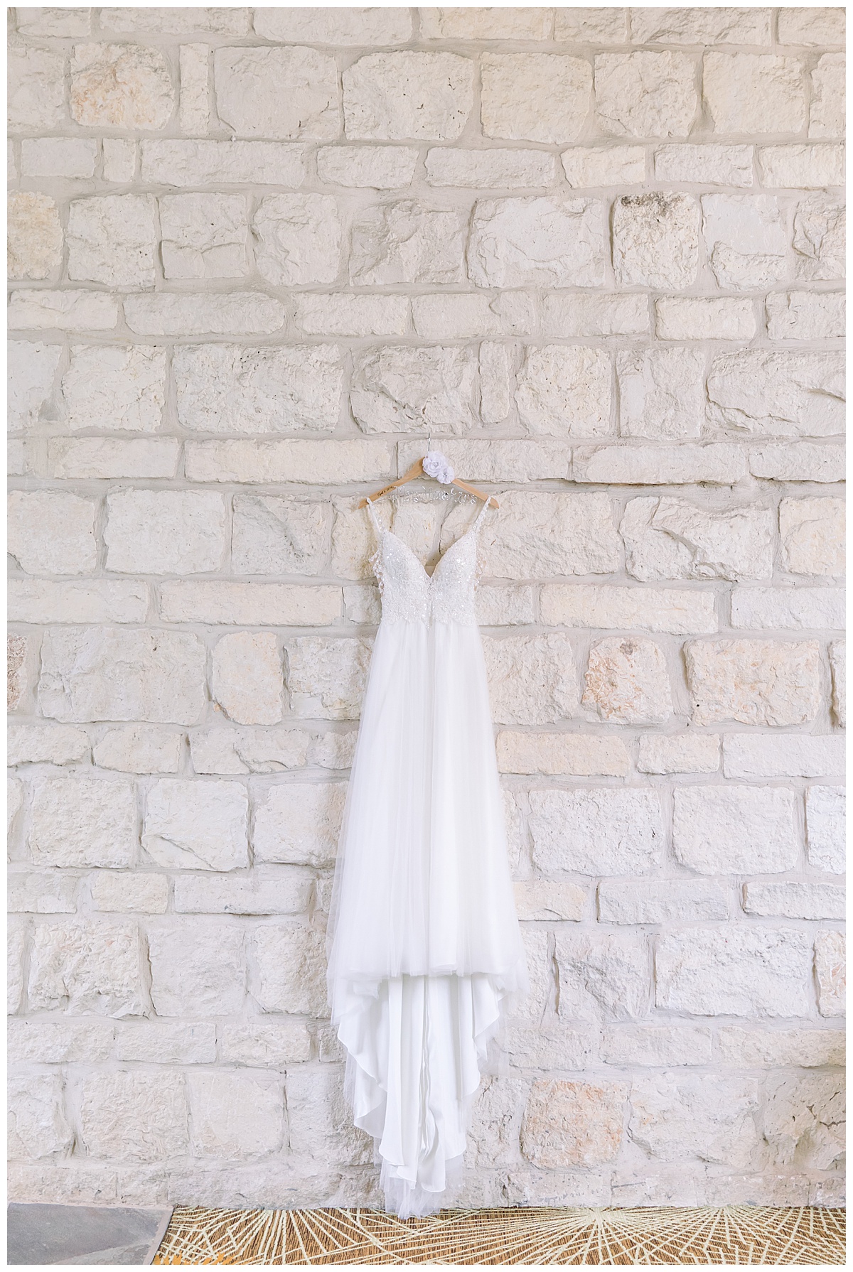 Wedding gown against stone wall at Hyatt Regency Hill Country Resort Wedding in San Antonio, TX | San Antonio Wedding photographer| Destination Wedding Photographer| Monica Roberts Photography | monicaroberts.com