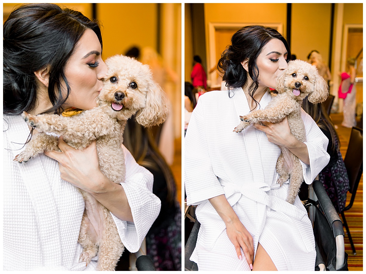 Bride in robe smooching her dog while getting ready at Hyatt Regency Hill Country Resort Wedding in San Antonio, TX | San Antonio Wedding photographer| Destination Wedding Photographer| Monica Roberts Photography | monicaroberts.com
