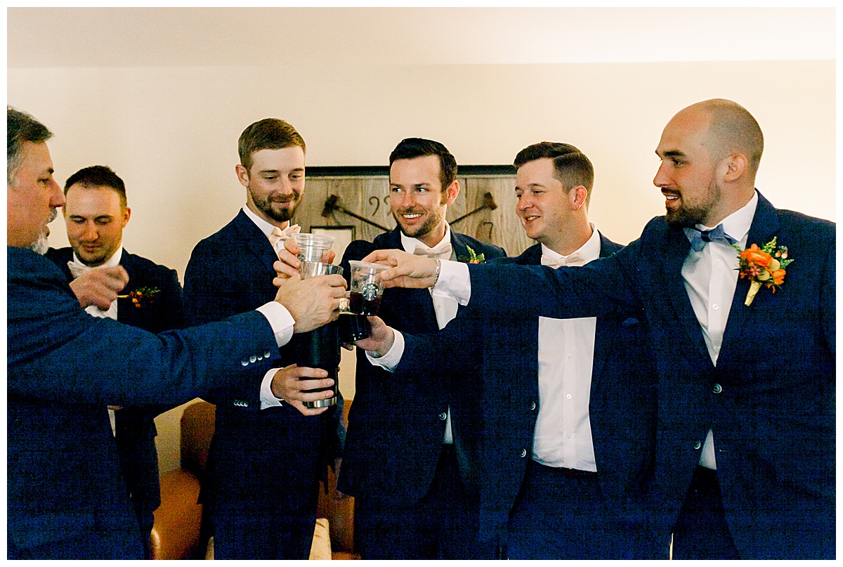 Groom and groomsmen toasting while getting ready at Hyatt Regency Hill Country Resort Wedding in San Antonio, TX | San Antonio Wedding photographer| Destination Wedding Photographer| Monica Roberts Photography | monicaroberts.com