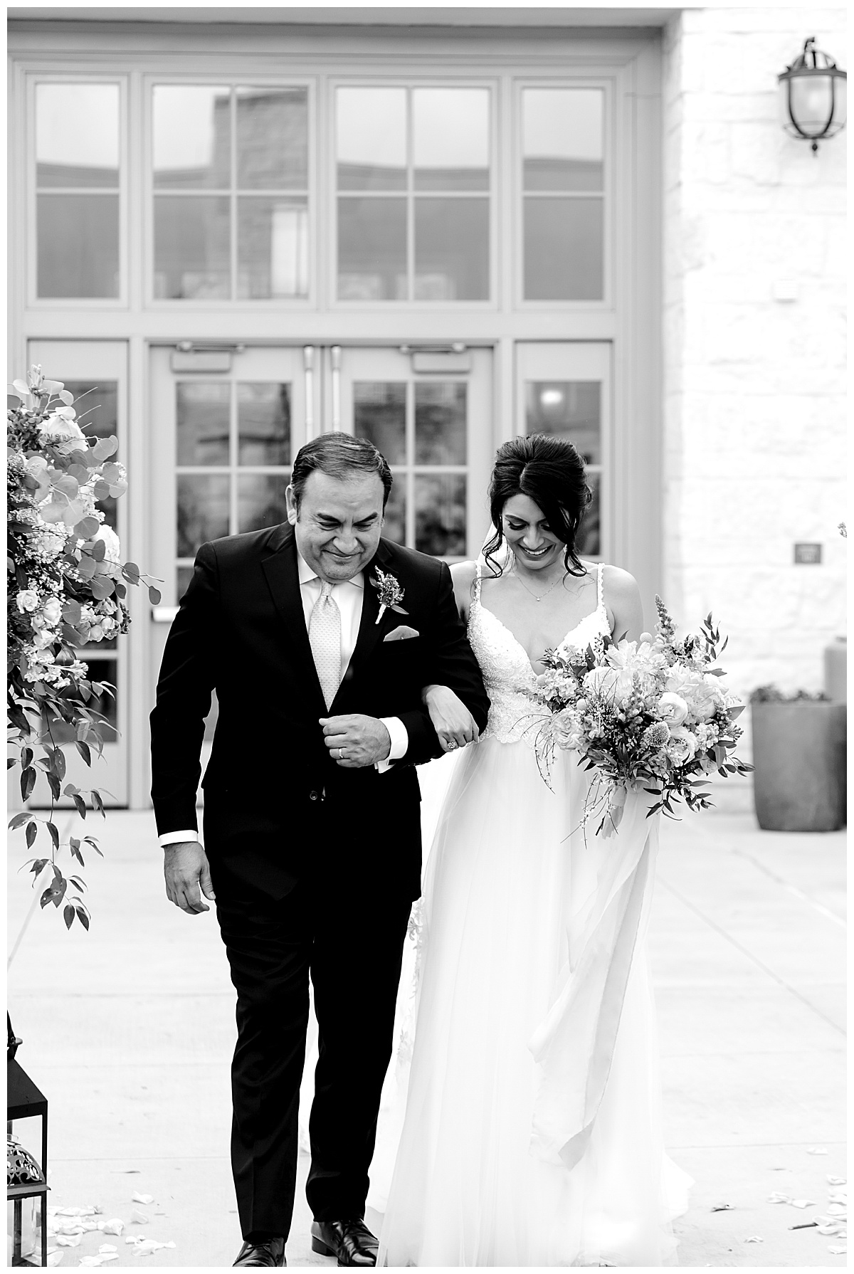 Black and white photo of bride walking down the aisle with father at Hyatt Regency Hill Country Resort Wedding in San Antonio, TX | San Antonio Wedding photographer| Destination Wedding Photographer| Monica Roberts Photography | monicaroberts.com
