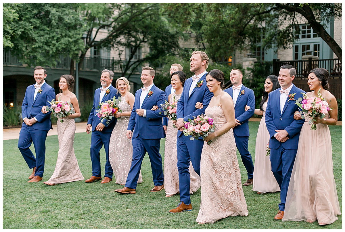 Bridal party walking on grass to reception at Hyatt Regency Hill Country Resort Wedding in San Antonio, TX | San Antonio Wedding photographer| Destination Wedding Photographer| Monica Roberts Photography | monicaroberts.com