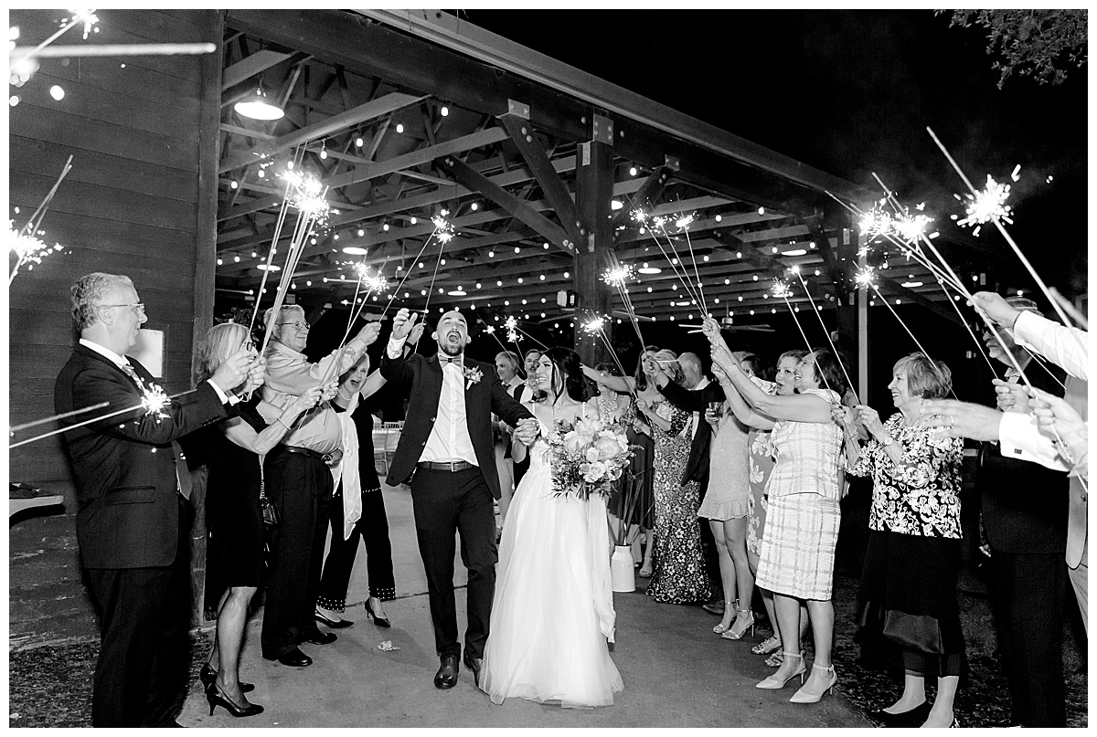 Black and white grand exit kiss with sparklers at Hyatt Regency Hill Country Resort Wedding in San Antonio, TX | San Antonio Wedding photographer| Destination Wedding Photographer| Monica Roberts Photography | monicaroberts.com