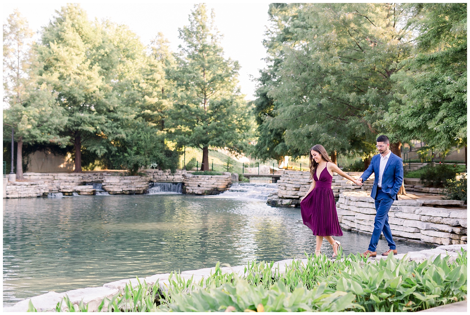 Couple walking in front of the water at their Hotel Emma Engagement session in San Antonio, TX with Monica Roberts Photography | www.monicaroberts.com