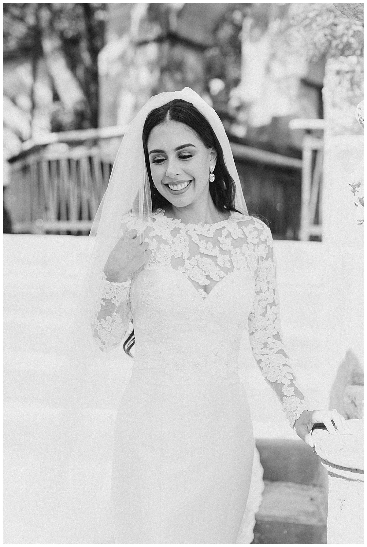 Black and white of bride in long sleeved lacy wedding dress| Villa Antonia bridal session| Austin, TX wedding photographer| www.monicaroberts.com