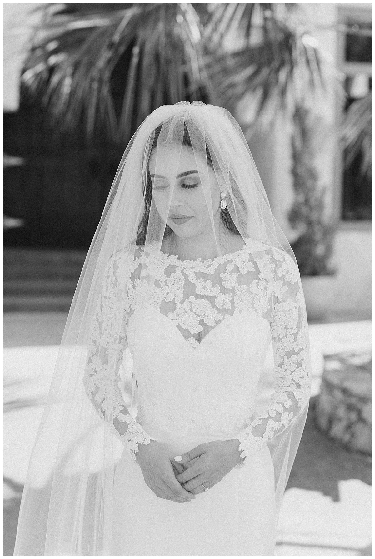 Black and white of bride in lacy long sleeved wedding dress| wedding veil covering face| Villa Antonia wedding| Austin, TX bride| Austin, TX wedding photographer| www.monicaroberts.com