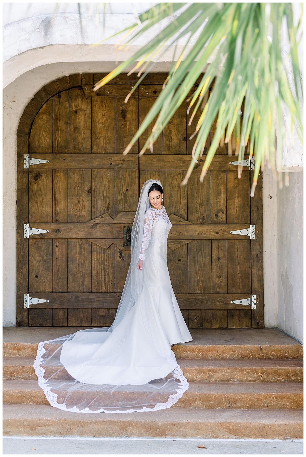 Bride standing in front of rustic Villa Antonia doors| villa wedding| Long wedding veil| long wedding train| Austin, TX wedding photographer| www.monicaroberts.com