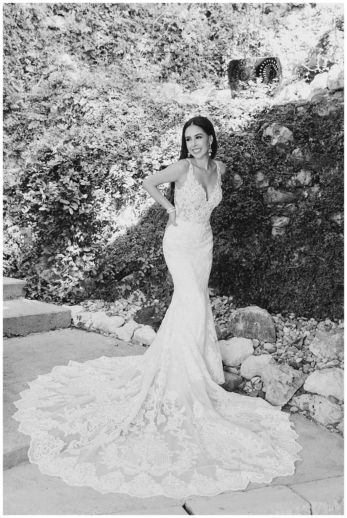Black and white of bride smiling in wedding gown| Lacy wedding gown train| Villa Antonia wedding venue| Austin, TX photographer| www.monicaroberts.com