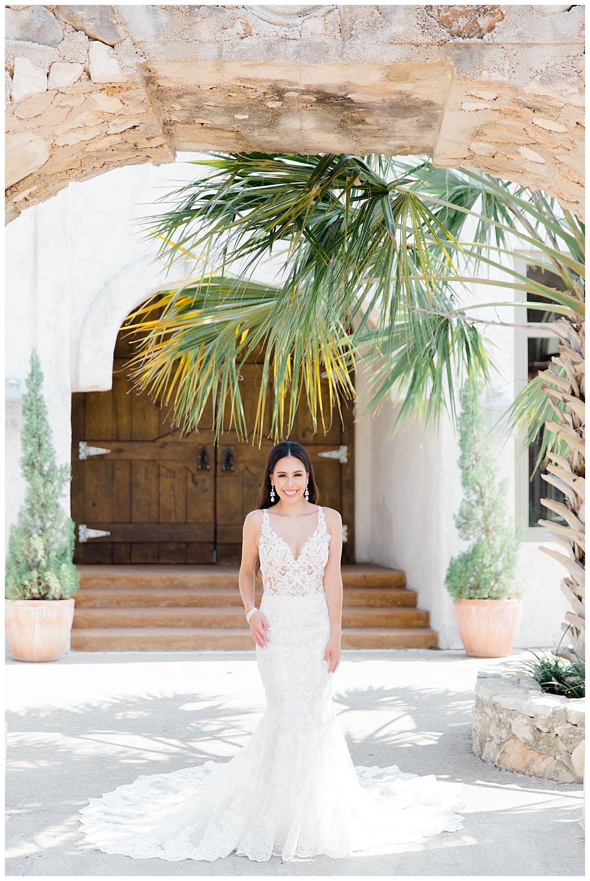 Bride stands under palm trees as Villa Antonia bridal session| Austin, TX wedding photographer| www.monicaroberts.com