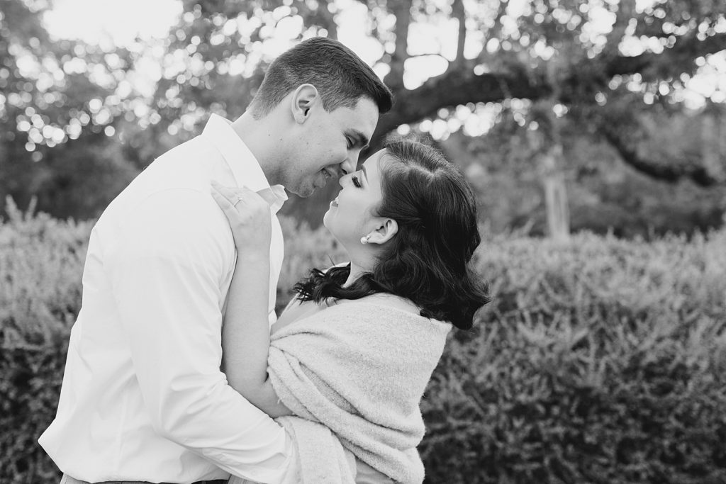timeless black and white image of couple smiling for a Romantic Engagement session at Kendall Plantation with Monica Roberts Photography www.monicaroberts.com