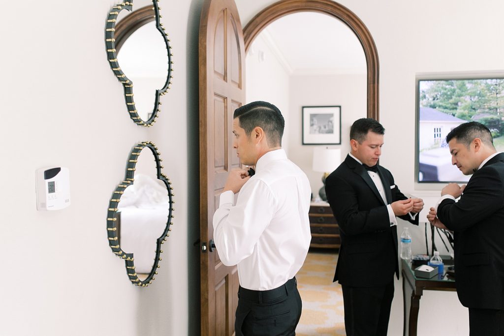 Groom getting ready for a wedding at the Jack Guenther Pavilion at the Briscoe in San Antonio with Monica Roberts Photography - https://monicaroberts.com/