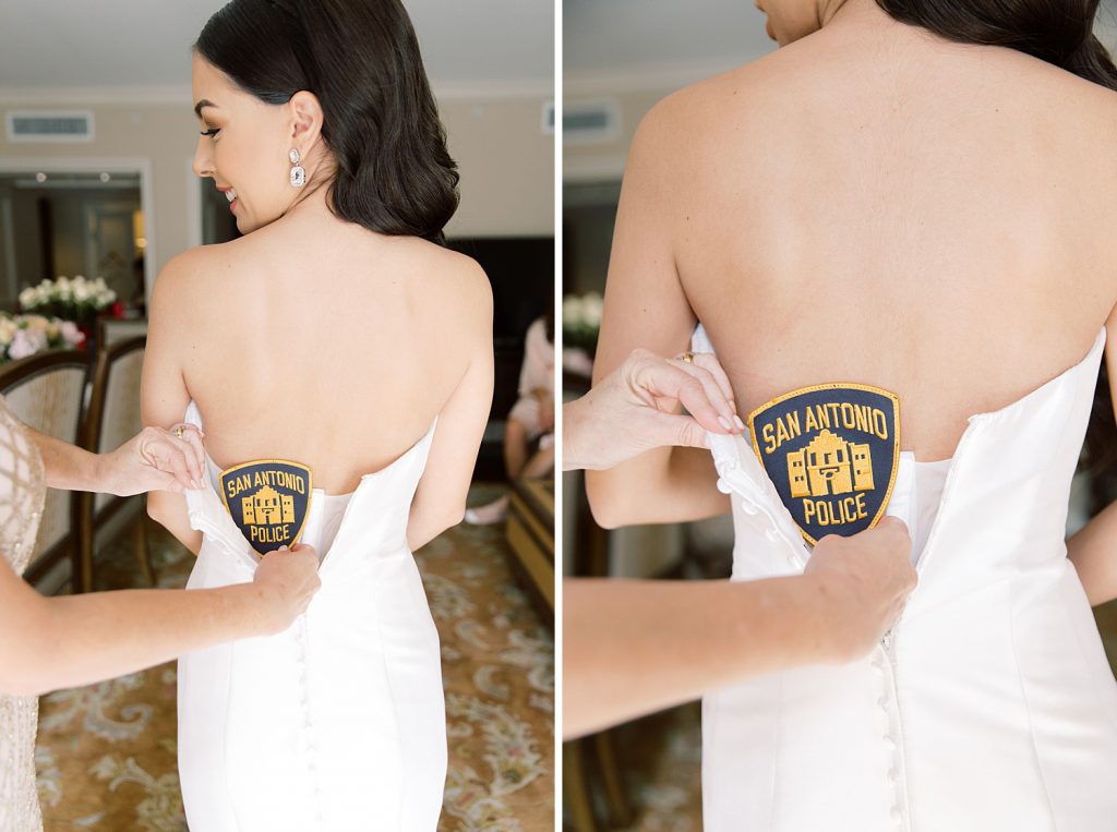 bride with police patch in her wedding dress for a wedding at the Jack Guenther Pavilion at the Briscoe in San Antonio with Monica Roberts Photography - https://monicaroberts.com/