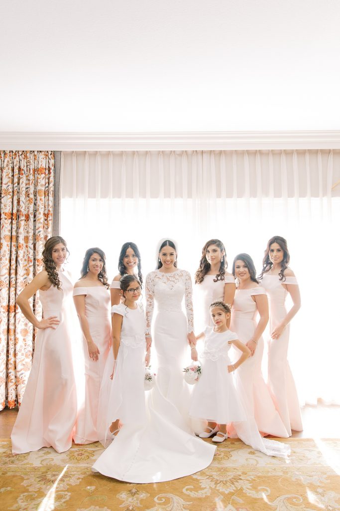 bride with her bridal party for a wedding at the Jack Guenther Pavilion at the Briscoe in San Antonio with Monica Roberts Photography - https://monicaroberts.com/
