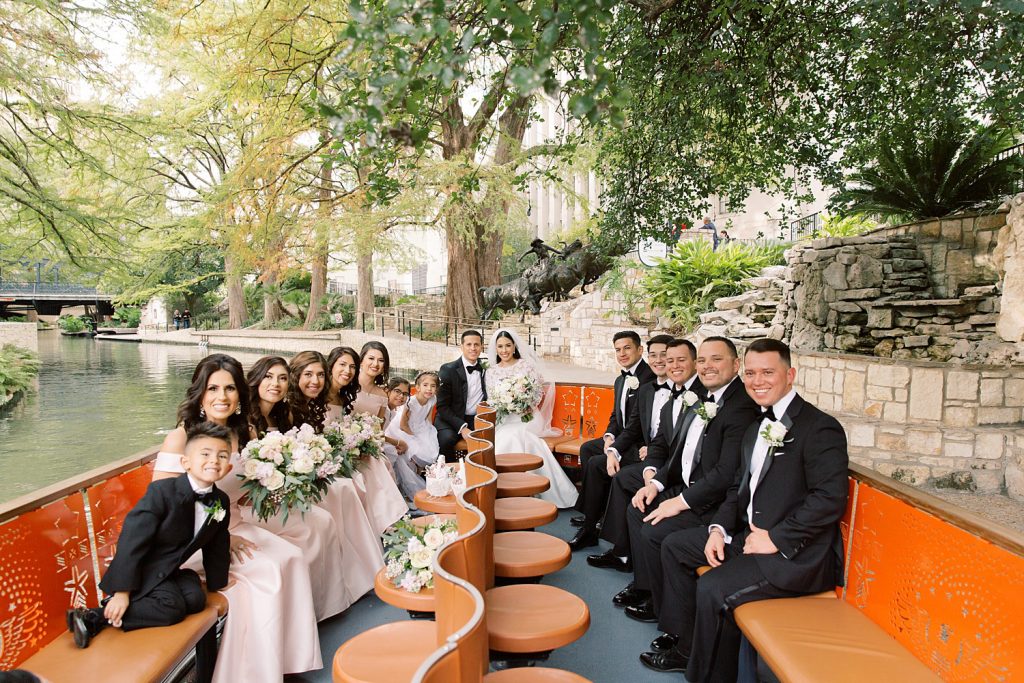 bridal party takes a ride on the riverboat for a wedding at the Jack Guenther Pavilion at the Briscoe in San Antonio with Monica Roberts Photography - https://monicaroberts.com/