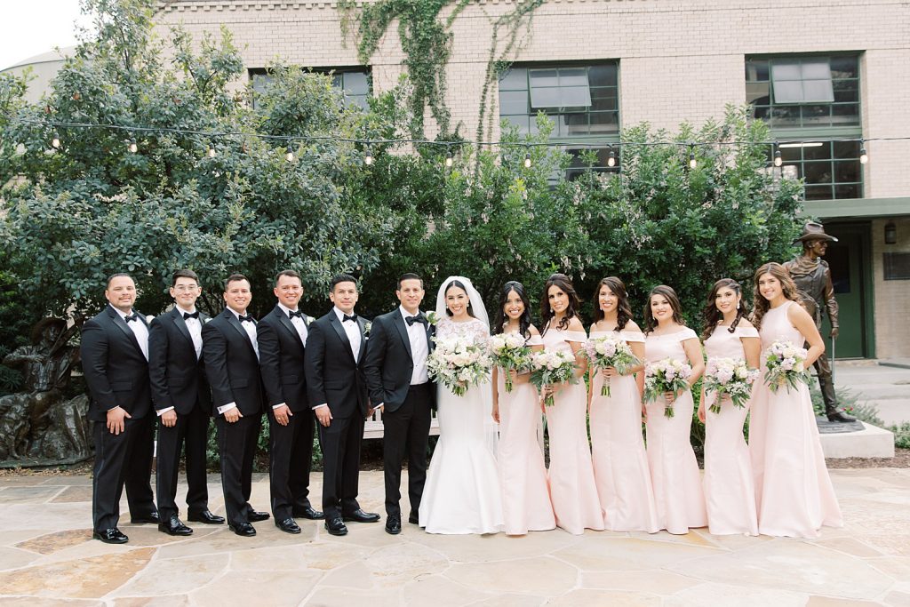 bridal party with blush pink accents for a wedding at the Jack Guenther Pavilion at the Briscoe in San Antonio with Monica Roberts Photography - https://monicaroberts.com/
