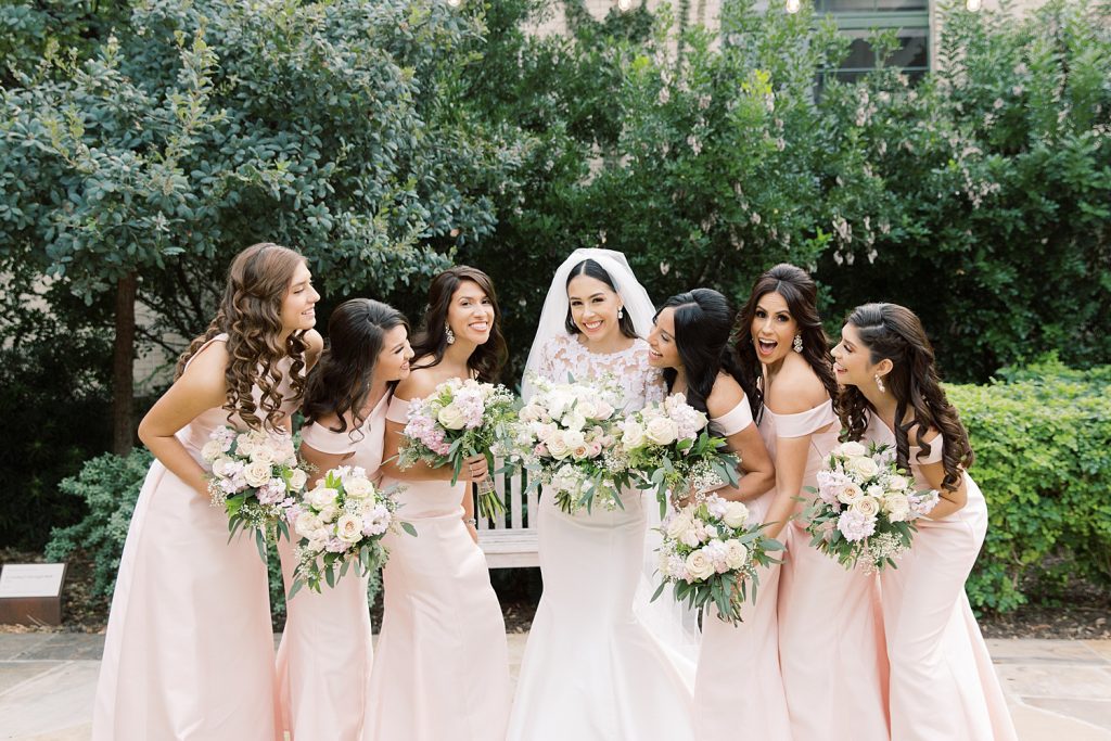 bridesmaids being playful for a wedding at the Jack Guenther Pavilion at the Briscoe in San Antonio with Monica Roberts Photography - https://monicaroberts.com/