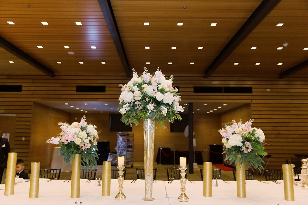 receptions details with pink and white flowers and gold flower holders for a wedding at the Jack Guenther Pavilion at the Briscoe in San Antonio with Monica Roberts Photography - https://monicaroberts.com/