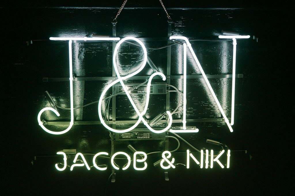 light up signature bar sign with wedding couples initials and name for a wedding at the Jack Guenther Pavilion at the Briscoe in San Antonio with Monica Roberts Photography - https://monicaroberts.com/