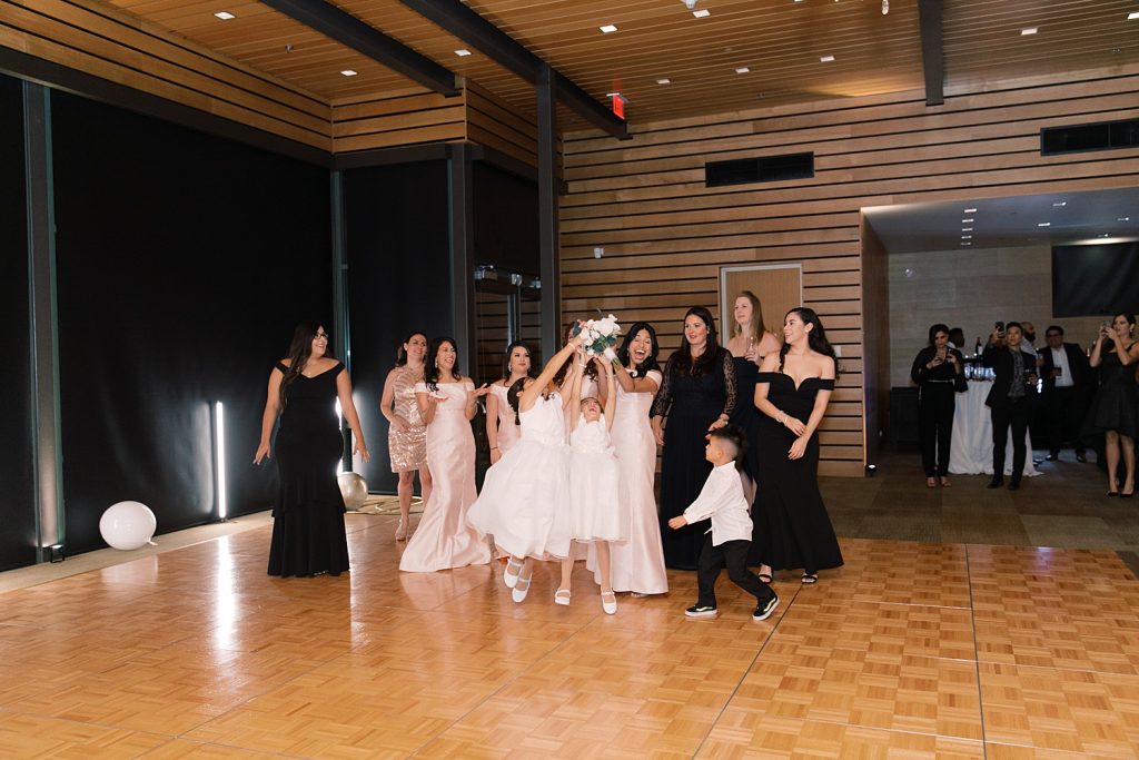 bouquet toss for a wedding at the Jack Guenther Pavilion at the Briscoe in San Antonio with Monica Roberts Photography - https://monicaroberts.com/
