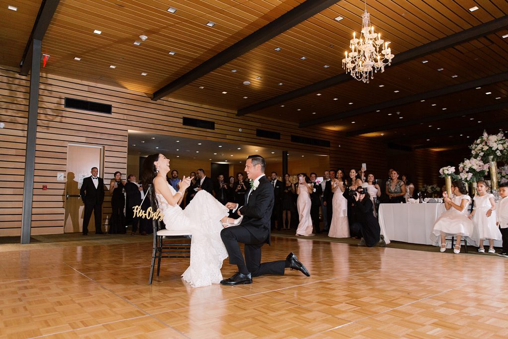 garter toss for a wedding at the Jack Guenther Pavilion at the Briscoe in San Antonio with Monica Roberts Photography - https://monicaroberts.com/