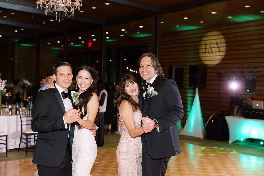 bride and groom dance with mother and father for a wedding at the Jack Guenther Pavilion at the Briscoe in San Antonio with Monica Roberts Photography - https://monicaroberts.com/