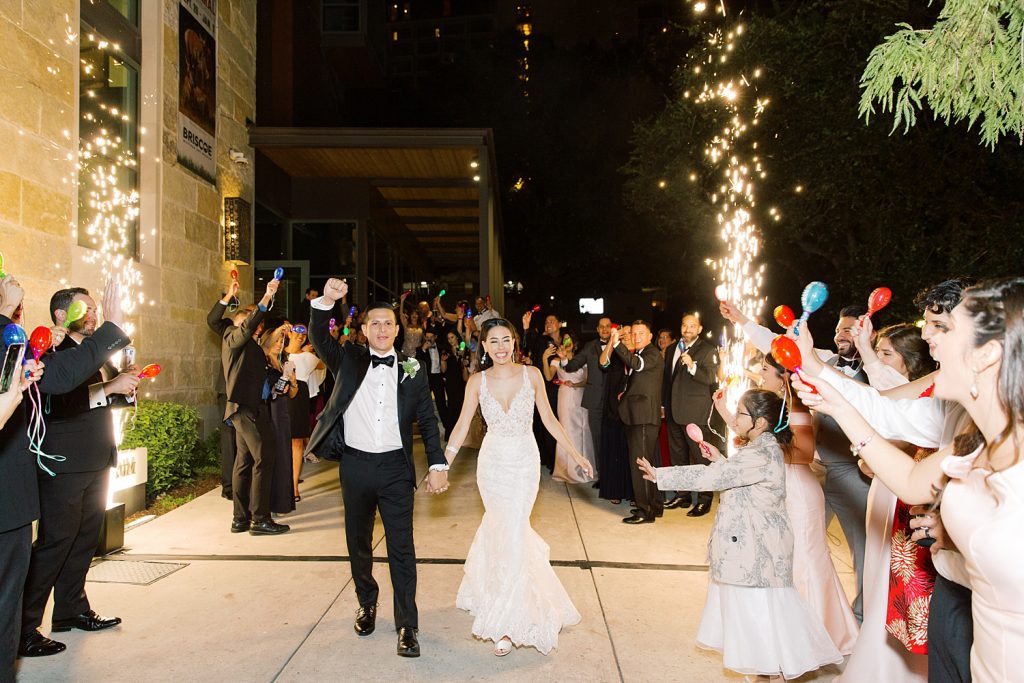 grand exit with water sparklers for a wedding at the Jack Guenther Pavilion at the Briscoe in San Antonio with Monica Roberts Photography - https://monicaroberts.com/