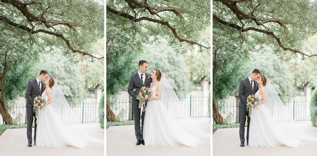 couple shares kiss under a tree for a gorgeous outdoor garden wedding at The Guenther House in San Antonio, TX | Monica Roberts Photography | www.monicaroberts.com
