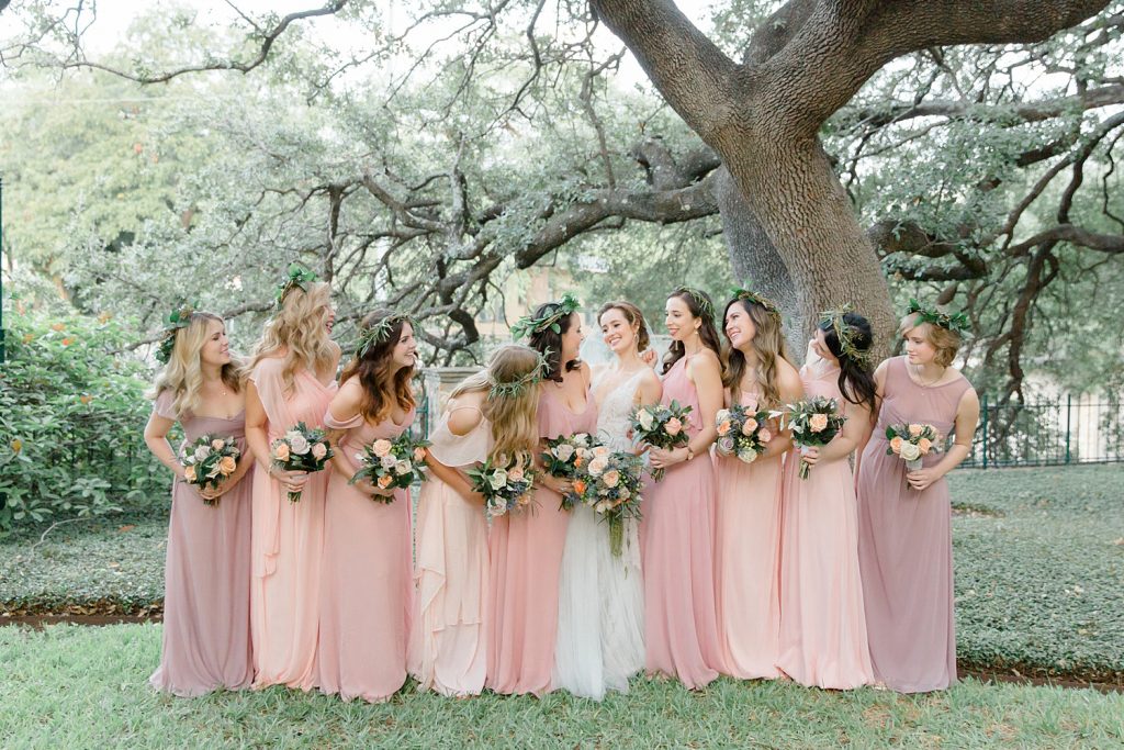 bride smiling with her bridesmaids for a gorgeous outdoor garden wedding at The Guenther House in San Antonio, TX | Monica Roberts Photography | www.monicaroberts.com