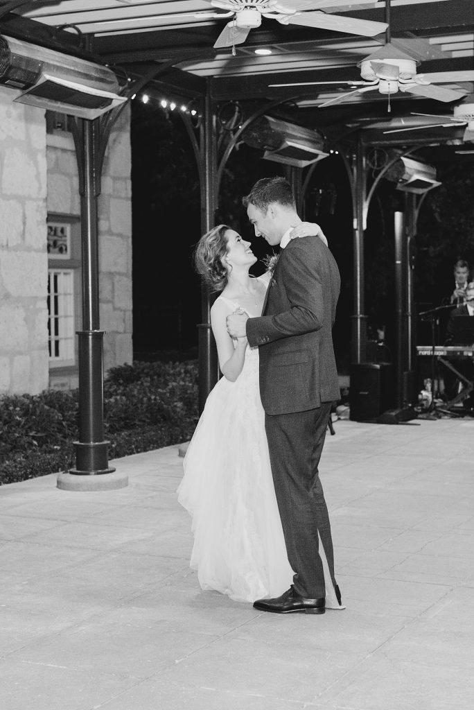black and white photo of couple dancing for a gorgeous outdoor garden wedding at The Guenther House in San Antonio, TX | Monica Roberts Photography | www.monicaroberts.com