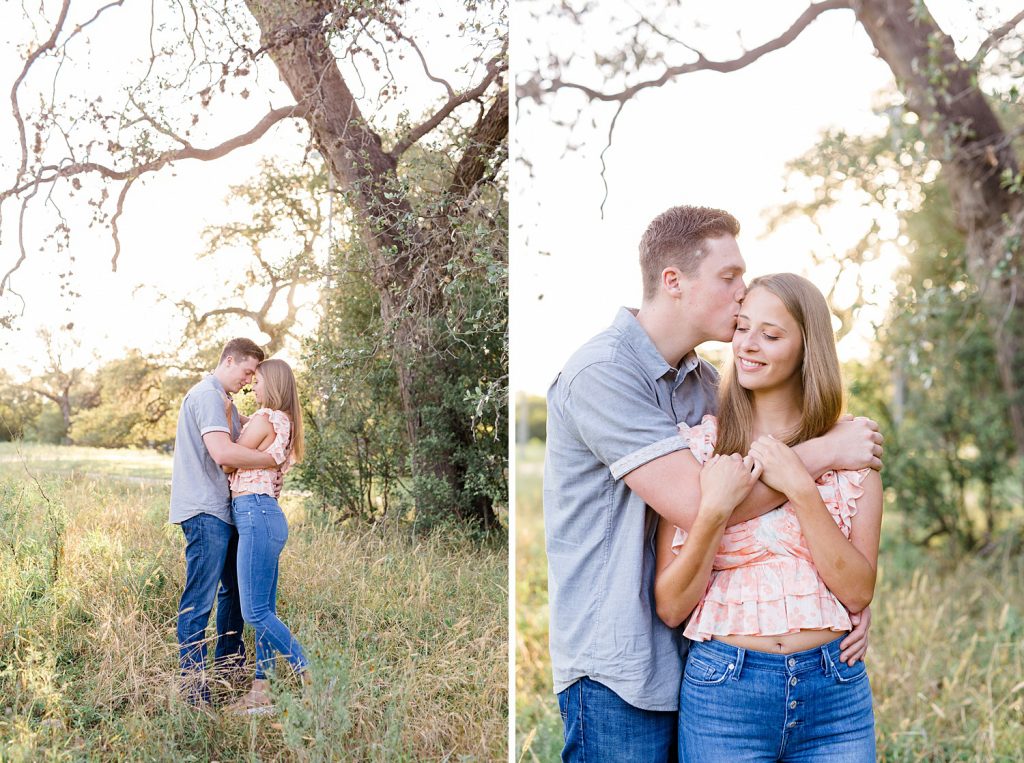 couple snuggles in a field in Downtown San Antonio for their engagement session with Monica Roberts Photography https://monicaroberts.com