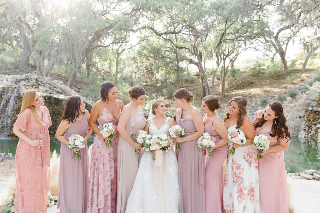 bridal party laughing and giggling for a Romantic dusty rose wedding at Hayes Hollow with Monica Roberts Photography https://monicaroberts.com/