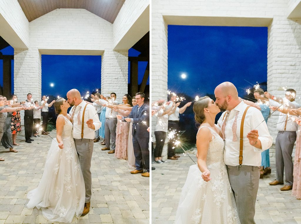 Couple kisses under sparklers and full moon for a Romantic dusty rose wedding at Hayes Hollow with Monica Roberts Photography https://monicaroberts.com/