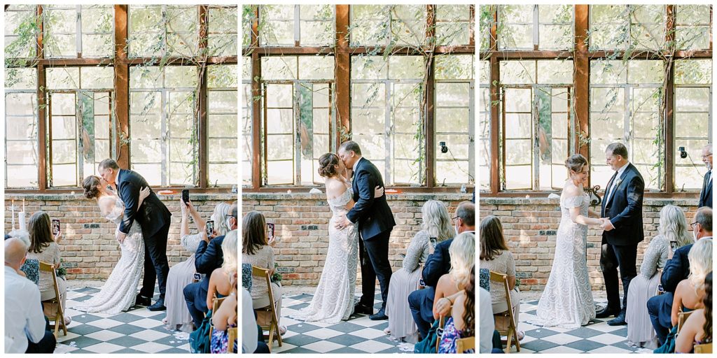 First kiss for the bride and groom in a greenhouse for theirMortgage Hall Estate by Monica Roberts Photography Wedding Photographer in Washington D.C.
