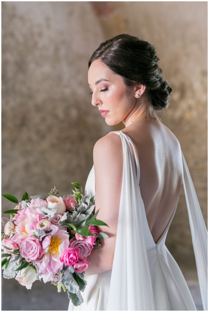 bride looking down at her bridal bouquet for her bridals in Richmond, Virginia