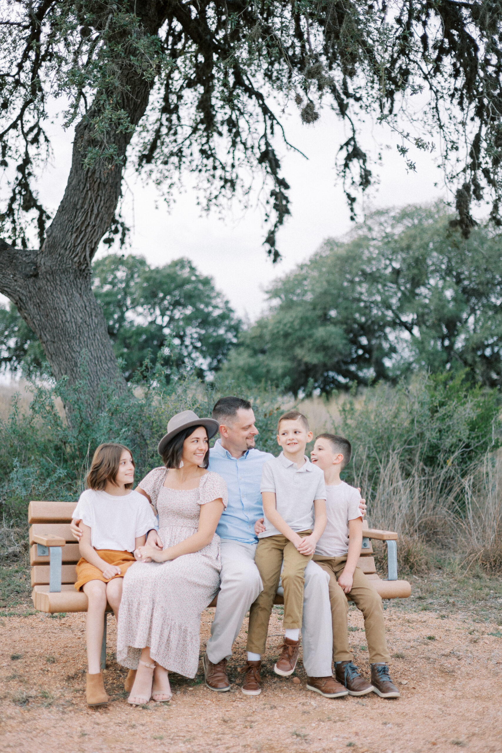 Family posing together in a festive outdoor setting during a mini session in Stafford, VA.